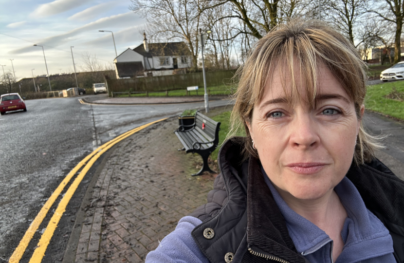 Abi Brown stood by some yellow lines on Caverswall Lane in Catchems Corner