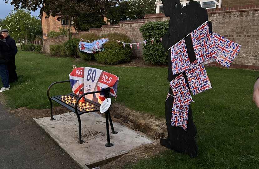 The memorial bench and soldier silhouette adorned for VE Day