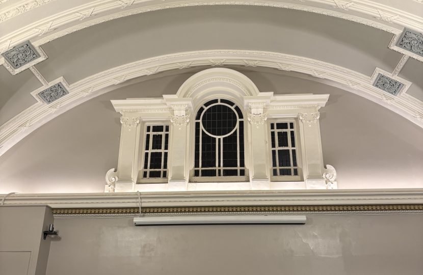 Two acoustic guitarists playing and singing in the Windsor Room