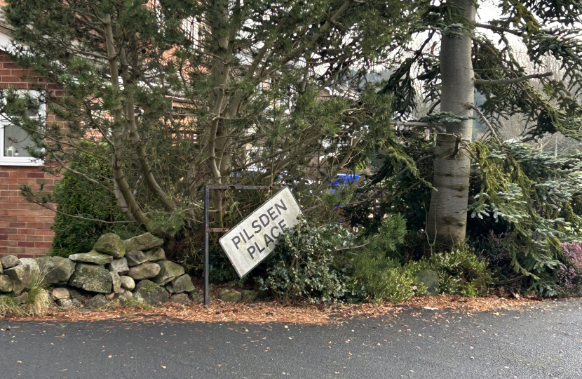 The damaged sign at Pilsden Place, Meir Park