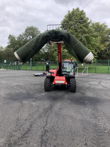 The old pitch being taken away!