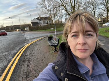 Abi Brown stood by some yellow lines on Caverswall Lane in Catchems Corner