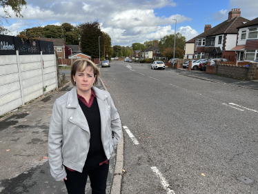 Abi Brown at Caverswall Lane where residents would like to see double yellow lines put down