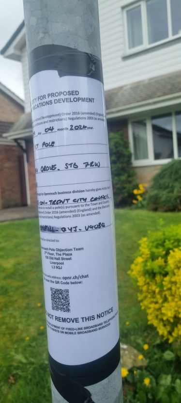 A BT Openreach notice on a streetlamp in Meir Park